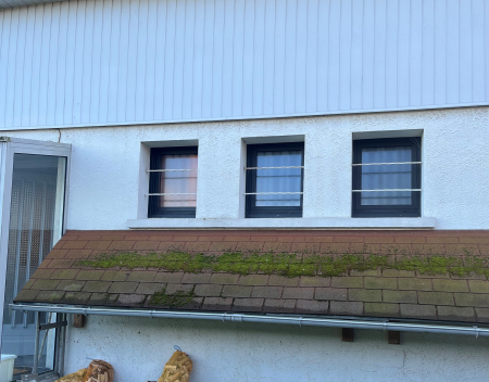 faire installer des fenêtres en PVC noir granité sur la maison située à Gainneville