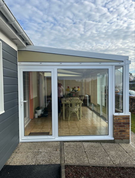 Transformation d’accès de véranda : porte d’entrée aluminium près du Havre